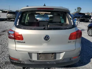 2014 Volkswagen Tiguan SE z VIN WVGAV3AXXEW502310, wystawiony jako Copart lot #42095985 z przebiegiem 130 033 mil mil oraz Szkoda całkowita • Salvage title. Historia ofert i sprzedaży dostępna na DreamBid. Obrazek 6.