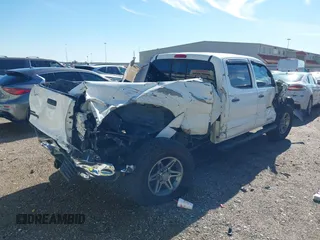2013 Toyota Tacoma PreRunner with VIN 3TMKU4HN8DM038566, listed as a IAAI auction lot 41296386 with 153,240 mi miles and . Bid and sale history available at DreamBid. Image 4.
