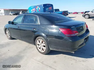 2009 Toyota Avalon XL with VIN 4T1BK36B89U335604, listed as a IAAI auction lot 41328877 with 166,396 mi miles. Bid and sale history available at carsss.com. Image 3.