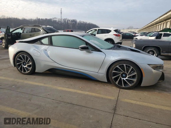 2015 BMW i8 z VIN WBY2Z2C56FV674231, wystawiony jako Copart lot #37218014 z przebiegiem 27 465 mil mil oraz . Historia ofert i sprzedaży dostępna na DreamBid. Obrazek 4.