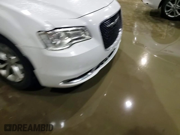 2015 Chrysler 300 Limited with VIN 2C3CCAAG5FH820184, listed as a Copart auction lot 84105134 with 210,459 mi miles and Salvage Title. Bid and sale history available at carsss.com. Image 10.