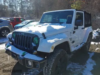 2012 Jeep Wrangler Arctic with VIN 1C4GJWBG9CL290847, listed as a IAAI auction lot 41281316 with 106,473 mi miles. Bid and sale history available at carsss.com. Image 2.