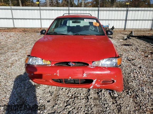 1999 Ford Escort SE z VIN 3FAFP15P0XR193865, wystawiony jako Copart lot #82397294 z przebiegiem 220 534 mil mil oraz Szkoda całkowita • Salvage title. Historia ofert i sprzedaży dostępna na DreamBid. Obrazek 5.