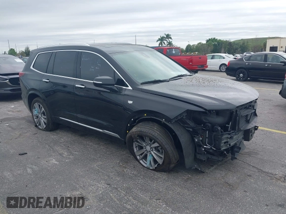 2023 Cadillac XT6 FWD Premium Luxury with VIN 1GYKPCRS6PZ106284, listed as a IAAI auction lot 41595617 with 32,795 mi miles and . Bid and sale history available at DreamBid. Image 1.