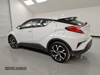 2021 Toyota C-HR LE z VIN NMTKHMBX0MR120577, wystawiony jako Copart lot #57019105 z przebiegiem 152 488 mil mil oraz Czysty tytuł • Clean title. Historia ofert i sprzedaży dostępna na DreamBid. Obrazek 2.