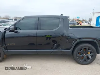 2023 Rivian R1T Adventure with VIN 7FCTGAAA2PN023485, listed as a IAAI auction lot 41227330 with 1 mi miles. Bid and sale history available at carsss.com. Image 14.