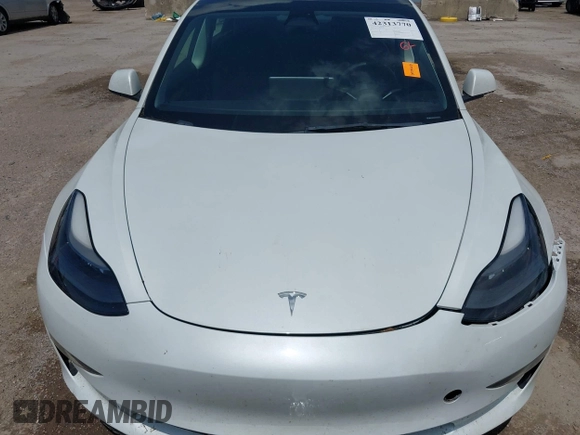 2023 Tesla Model 3 with VIN 5YJ3E1EA5PF407054, listed as a IAAI auction lot 42313770 with 57,621 mi miles and . Bid and sale history available at DreamBid. Image 10.