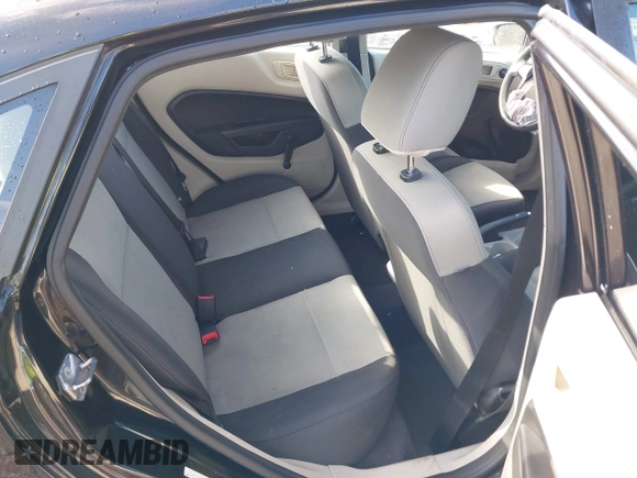 2013 Ford Fiesta S z VIN 3FADP4AJ2DM129703, wystawiony jako IAAI lot #41669041 z przebiegiem 138 831 mil mil oraz . Historia ofert i sprzedaży dostępna na DreamBid. Obrazek 8.