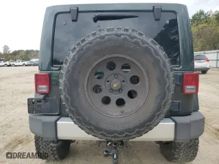 2011 Jeep Wrangler Unlimited Sahara with VIN 1J4BA5H16BL557068, listed as a Copart auction lot 80429454 with 142,428 mi miles and Salvage Title. Bid and sale history available at carsss.com. Image 6.