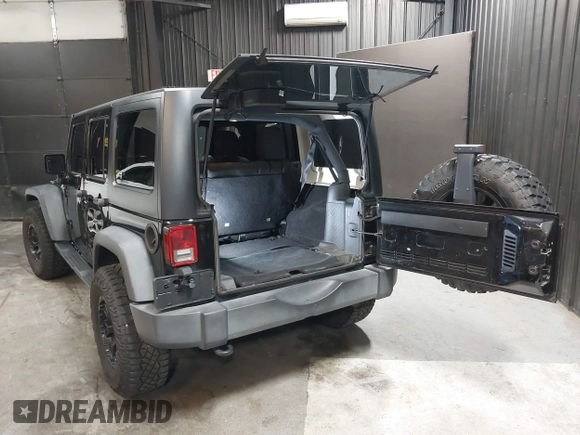 2015 Jeep Wrangler Unlimited Willys Wheeler with VIN 1C4BJWDG1FL749803, listed as a IAAI auction lot 41995132 with 156,595 mi miles and . Bid and sale history available at DreamBid. Image 3.