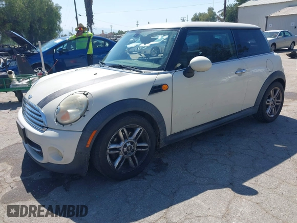 2011 MINI Hardtop with VIN WMWSU3C53BTX97140, listed as a IAAI auction lot 41861648 with 111,899 mi miles and . Bid and sale history available at DreamBid. Image 2.