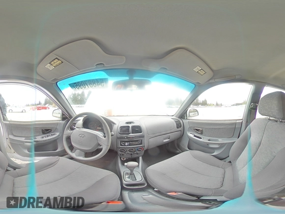 2005 Hyundai Accent GLS z VIN KMHCG45C75U639281, wystawiony jako Copart lot #54887095 z przebiegiem 136 090 mil mil oraz Szkoda całkowita • Salvage title. Historia ofert i sprzedaży dostępna na DreamBid. Obrazek 14.