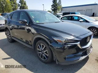 2018 Mazda CX-5 Grand Touring with VIN JM3KFBDM4J0348165, listed as a Copart auction lot 62733665 with 80,693 mi miles and Salvage title. Bid and sale history available at DreamBid. Image 4.