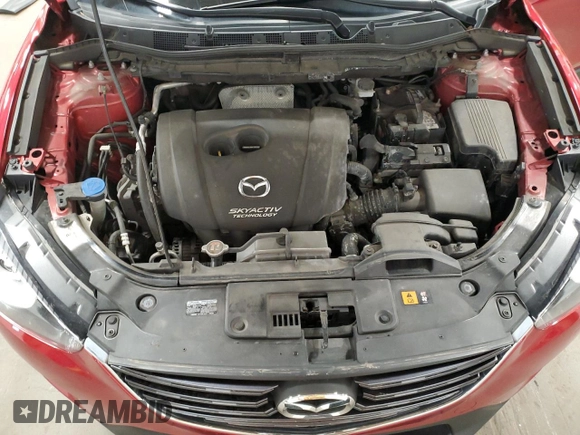 2016 Mazda CX-5 Touring z VIN JM3KE4CY7G0898598, wystawiony jako Copart lot #56717895 z przebiegiem 103 548 mil mil oraz Szkoda całkowita • Salvage title. Historia ofert i sprzedaży dostępna na DreamBid. Obrazek 12.