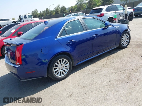 2012 Cadillac CTS Luxury with VIN 1G6DE5E59C0102621, listed as a IAAI auction lot 42554121 with 128,430 mi miles and . Bid and sale history available at DreamBid. Image 4.