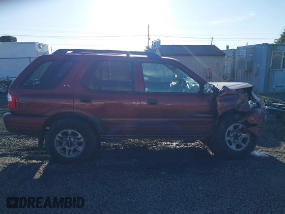 2002 Isuzu Rodeo with VIN 4S2DM58W624335632, listed as a IAAI auction lot 41690735 with 186,480 mi miles and . Bid and sale history available at DreamBid. Image 14.