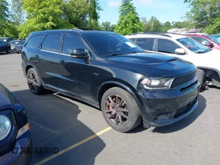 2018 Dodge Durango SRT with VIN 1C4SDJGJ5JC142443, listed as a IAAI auction lot 42401246 with 106,260 mi miles and . Bid and sale history available at DreamBid. Image 1.