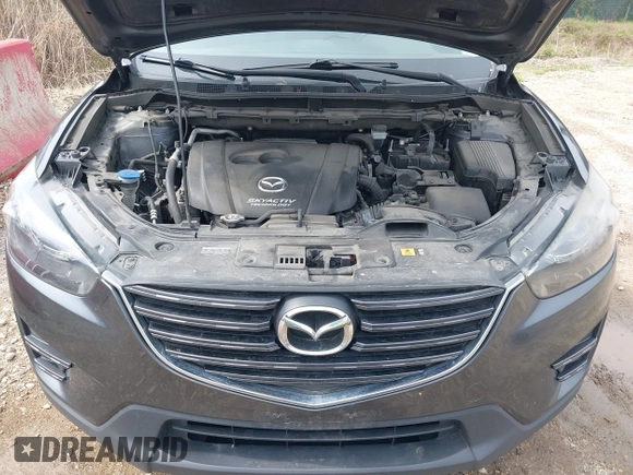 2016 Mazda CX-5 Grand Touring with VIN JM3KE4DYXG0830150, listed as a IAAI auction lot 41961007 with 142,570 mi miles and . Bid and sale history available at DreamBid. Image 10.