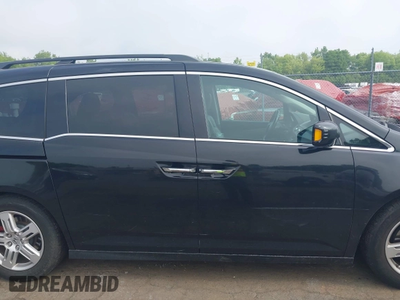 2011 Honda Odyssey Touring with VIN 5FNRL5H93BB104906, listed as a IAAI auction lot 42371279 with 183,856 mi miles and . Bid and sale history available at DreamBid. Image 13.