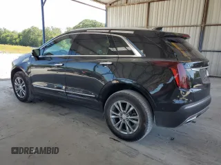 2021 Cadillac XT5 FWD Premium Luxury с VIN 1GYKNCRSXMZ155473, выставлен на аукционе Copart как лот 59883874 с пробегом 2 038 миль миль и Списание • Salvage title. История ставок и продаж доступна на DreamBid. Изображение 2.