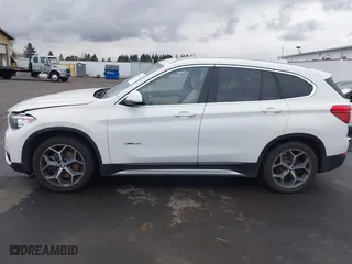 2018 BMW X1 sDrive28i with VIN WBXHU7C32J5H44246, listed as a IAAI auction lot 41477050 with 69,858 mi miles. Bid and sale history available at carsss.com. Image 14.