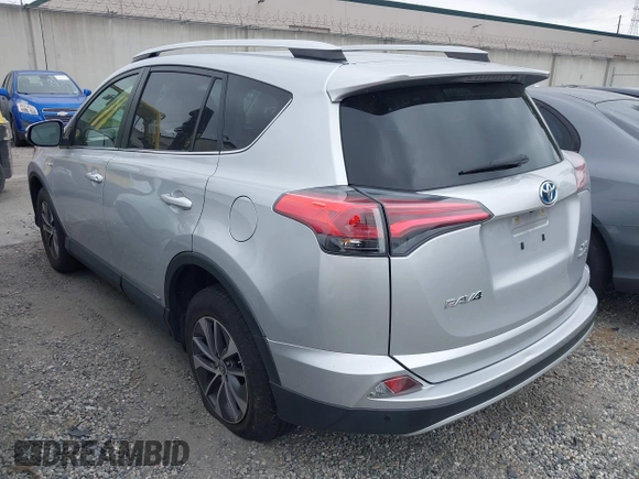 2016 Toyota RAV4 Hybrid XLE with VIN JTMRJREVXGD029019, listed as a IAAI auction lot 42021530 with 74,400 mi miles. Bid and sale history available at carsss.com. Image 3.