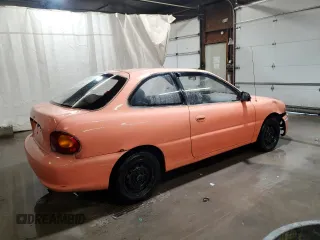 1997 Hyundai Accent z VIN KMHVD14NXVU221266, wystawiony jako Copart lot #86383044 z przebiegiem 159 517 mil mil oraz Szkody całkowita. Historia ofert i sprzedaży dostępna na DreamBid. Obrazek 3.