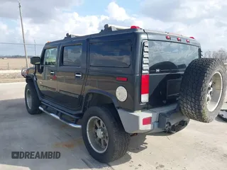 2006 Hummer H2 with VIN 5GRGN23U66H120601, listed as a IAAI auction lot 41524634 with 155,003 mi miles. Bid and sale history available at carsss.com. Image 3.