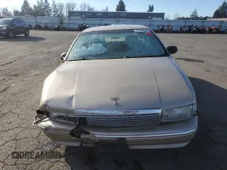 1995 Chevrolet Caprice z VIN 1G1BL52W8SR129349, wystawiony jako Copart lot #41795435 z przebiegiem Nie podano mil oraz Szkoda całkowita • Salvage title. Historia ofert i sprzedaży dostępna na DreamBid. Obrazek 5.