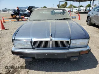 1992 Jaguar XJ with VIN SAJHY174XNC649368, listed as a Copart auction lot 50191454 with 99,553 mi miles and Salvage Title. Bid and sale history available at DreamBid. Image 5.