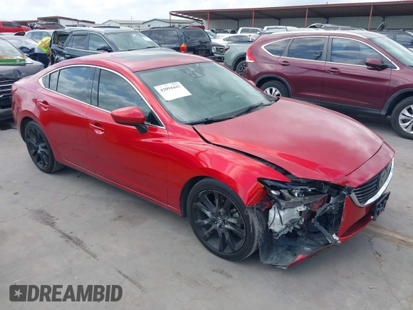 2016 Mazda 6 i Grand Touring z VIN JM1GJ1W58G1486694, wystawiony jako IAAI lot #42094443 z przebiegiem 77 803 mil mil oraz . Historia ofert i sprzedaży dostępna na DreamBid. Obrazek 1.