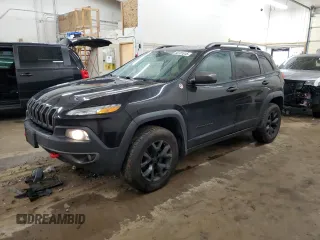 2015 Jeep Cherokee Trailhawk z VIN 1C4PJMBS0FW598694, wystawiony jako Copart lot #60731615 z przebiegiem 130 219 mil mil oraz Czysty tytuł • Clean title. Historia ofert i sprzedaży dostępna na DreamBid. Obrazek 1.