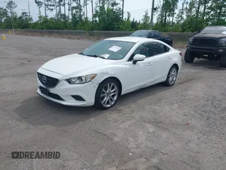 2014 Mazda 6 i Touring with VIN JM1GJ1V64E1142643, listed as a IAAI auction lot 42229322 with 215,095 mi miles and . Bid and sale history available at DreamBid. Image 2.