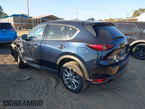 2021 Mazda CX-5 Grand Touring Reserve with VIN JM3KFBAYXM0465762, listed as a IAAI auction lot 40728368 with 30,667 mi miles. Bid and sale history available at carsss.com. Image 3.
