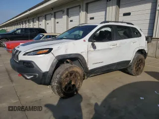 2015 Jeep Cherokee Trailhawk with VIN 1C4PJMBSXFW733230, listed as a Copart auction lot 56843805 with 107,639 mi miles and Salvage title. Bid and sale history available at DreamBid. Image 1.