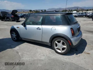 2003 MINI Hardtop with VIN WMWRC33453TE14909, listed as a Copart auction lot 65419725 with 111,960 mi miles and Salvage title. Bid and sale history available at DreamBid. Image 2.