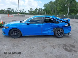2023 Honda Civic Sport Touring z VIN 19XFL1H84PE002868, wystawiony jako IAAI lot #41978174 z przebiegiem 42 604 mil mil oraz . Historia ofert i sprzedaży dostępna na DreamBid. Obrazek 14.