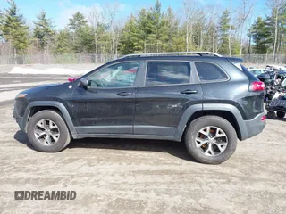 2014 Jeep Cherokee Trailhawk with VIN 1C4PJMBS3EW127749, listed as a IAAI auction lot 41836617 with 207,002 mi miles and . Bid and sale history available at DreamBid. Image 14.