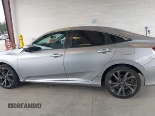 2021 Honda Civic Sport with VIN 2HGFC2F83MH521470, listed as a IAAI auction lot 41828890 with 49,703 mi miles and . Bid and sale history available at DreamBid. Image 14.