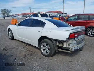 2014 Dodge Charger SE with VIN 2C3CDXBG5EH197260, listed as a IAAI auction lot 42072916 with 183,206 mi miles and . Bid and sale history available at DreamBid. Image 3.