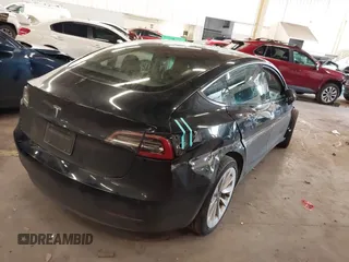 2022 Tesla Model 3 with VIN 5YJ3E1EA4NF187113, listed as a IAAI auction lot 41712331 with 81,879 mi miles and . Bid and sale history available at DreamBid. Image 4.
