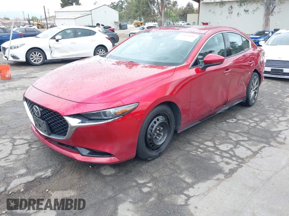 2021 Mazda 3 with VIN JM1BPBDL6M1305765, listed as a IAAI auction lot 42063684 with 61,011 mi miles and . Bid and sale history available at DreamBid. Image 2.