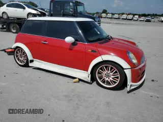 2004 MINI Hardtop with VIN WMWRC33444TC50103, listed as a Copart auction lot 63449615 with 144,467 mi miles and Salvage title. Bid and sale history available at DreamBid. Image 4.