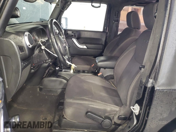 2013 Jeep Wrangler Rubicon with VIN 1C4BJWCG1DL584611, listed as a Copart auction lot 71536944 with 142,975 mi miles and Salvage title. Bid and sale history available at DreamBid. Image 7.