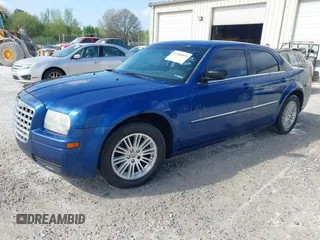 2009 Chrysler 300 LX with VIN 2C3KA43D69H614978, listed as a IAAI auction lot 41966879 with 247,871 mi miles. Bid and sale history available at carsss.com. Image 2.