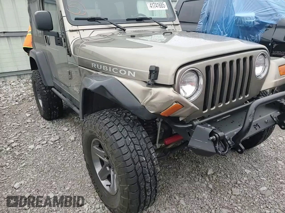 2003 Jeep Wrangler Rubicon z VIN 1J4FA69S13P345591, wystawiony jako Copart lot #41741685 z przebiegiem 85 335 mil mil oraz Szkoda całkowita • Salvage title. Historia ofert i sprzedaży dostępna na DreamBid. Obrazek 12.