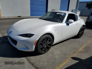 2024 Mazda MX-5 Miata Grand Touring z VIN JM1NDAM76R0602972, wystawiony jako Copart lot #77665904 z przebiegiem 4 965 mil mil oraz Szkoda całkowita • Salvage title. Historia ofert i sprzedaży dostępna na DreamBid. Obrazek 1.