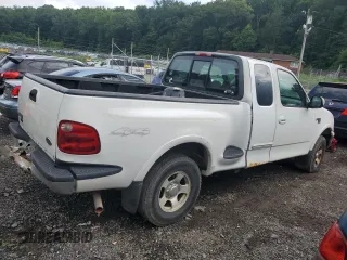 2000 Ford F-150 with VIN 2FTRX08W3YCA36619, listed as a Copart auction lot 62683885 with Not provided miles and Salvage title. Bid and sale history available at DreamBid. Image 3.