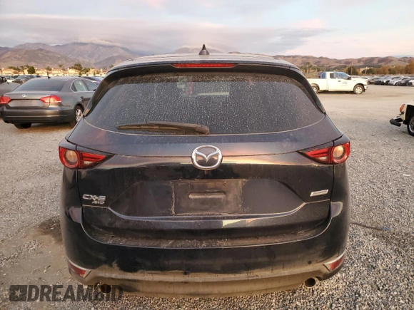 2018 Mazda CX-5 Grand Touring with VIN JM3KFBDM9J1326933, listed as a Copart auction lot 82180164 with 99,574 mi miles and Salvage title. Bid and sale history available at DreamBid. Image 6.