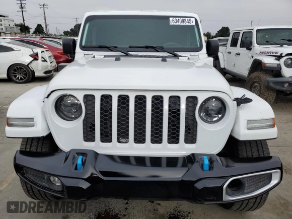 2023 Jeep Wrangler Sahara with VIN 1C4JJXP63PW536694, listed as a Copart auction lot 63409845 with 32,560 mi miles and Salvage title. Bid and sale history available at DreamBid. Image 5.
